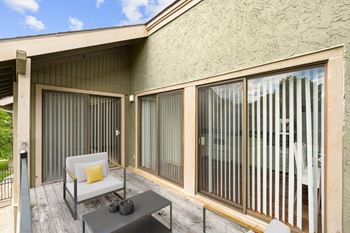 Private patio with a table and chair 